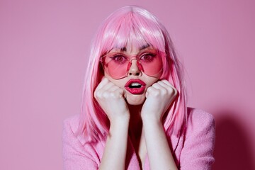 Beautiful fashionable girl bright makeup pink hair glamor stylish glasses color background unaltered