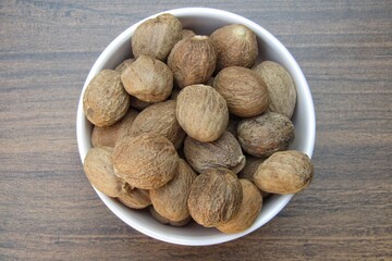 Nutmeg in a bowl top view 