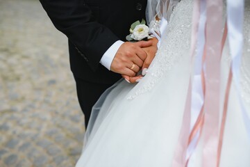Hands of the bride and groom close-up