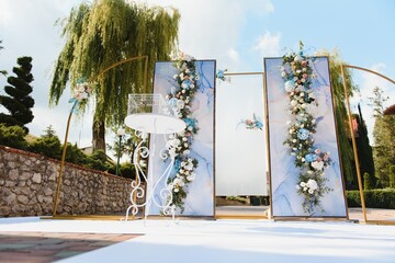 wonderful wedding ceremony. trendy wedding arch made according to modern fashion. wedding decorations.