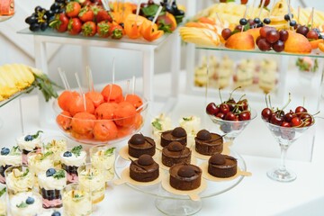 various dessert with fresh fruit on buffet line, sweet