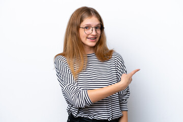 Teenager Russian girl isolated on white background pointing back