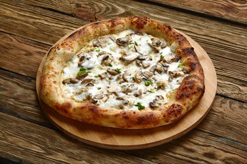 Appetizing pizza with mushrooms on a wooden tray