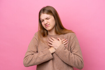 Teenager Russian girl isolated on pink background having a pain in the heart