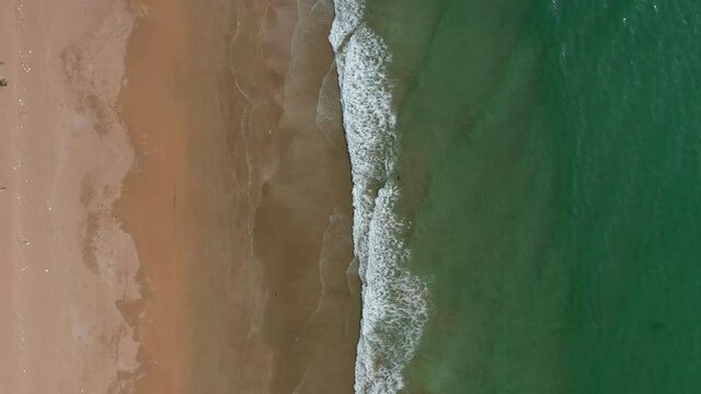 Looking Down At Beach And Waves At Balochistan. Aerial Dolly Left