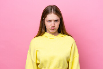 Fototapeta premium Teenager Russian girl isolated on pink background with sad expression
