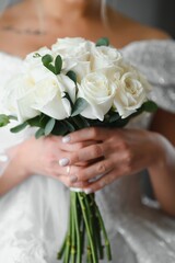 Bride holds a wedding bouquet, wedding dress, wedding details