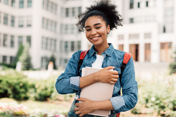 Happy African American Teenager Girl Posing Near Modern University Building