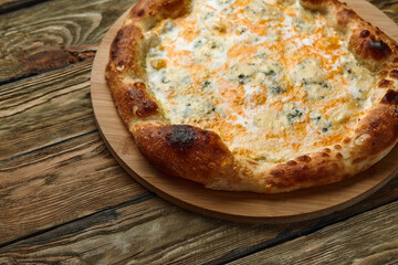 Italian Pizza Quattro formaggi. Italian pizza on dark stone background