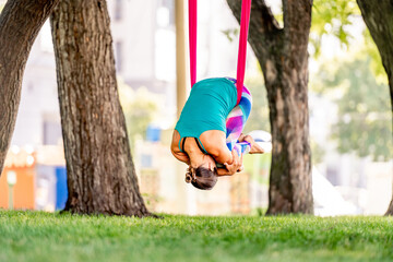 Girl doing fly yoga