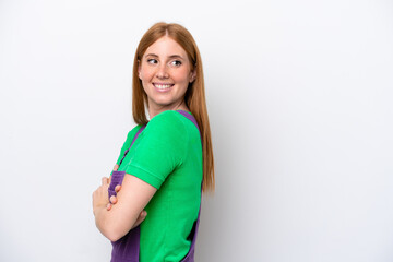 Young redhead woman isolated on white background with arms crossed and happy