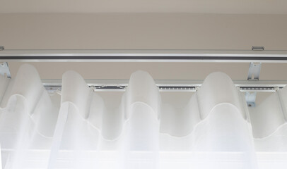 White curtain with curtain rails