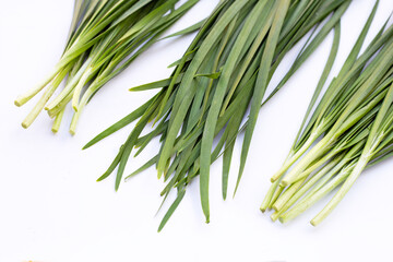 Fresh Chinese Chive leaves on white background.