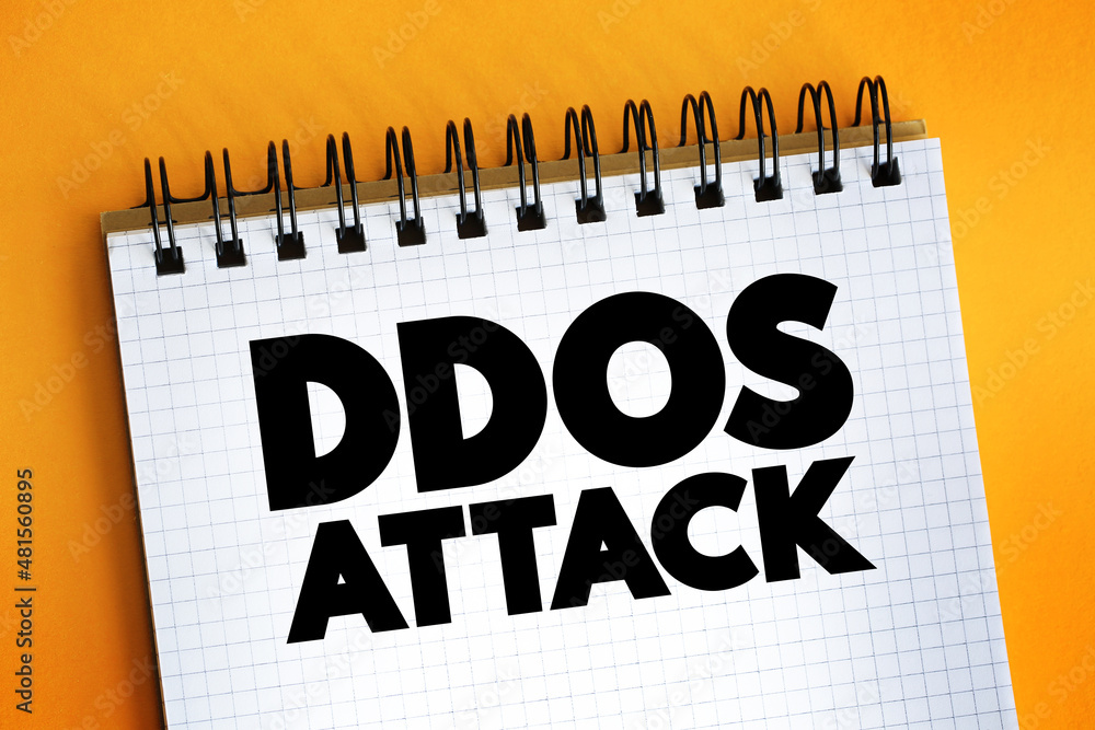 Poster ddos attack text on notepad, concept background