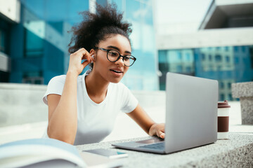 African Student Girl Making Video Call At Laptop Sitting Outdoor
