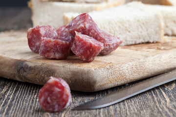 sliced sausage of dried meat with bacon
