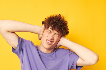 red-haired curly guy in a purple t-shirt gesture hands emotions