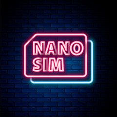 Obraz premium Glowing neon line Nano Sim Card icon isolated on brick wall background. Mobile and wireless communication technologies. Network chip electronic connection. Colorful outline concept. Vector