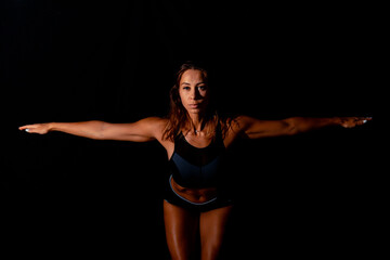 Fototapeta na wymiar Fitness female woman with muscular body, do her workout. Attractive sexy fitness woman, trained female body, lifestyle portrait, caucasian model.