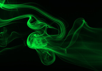 Green smoke abstract on black background for design. darkness concept