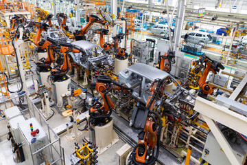 Car bodies are on assembly line. Factory for production of cars. Modern automotive industry....