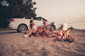 Full size photo of young couple happy positive smile sit blanket beach seaside honeymoon snack food...