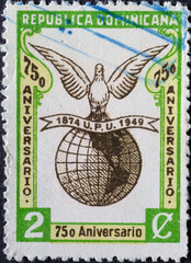 Dominican Republic - Circa 1949 A postage stamp from Dominican Republic showing a Globe with Dove. 75th Anniversary of Universal Postal Union (UPU)