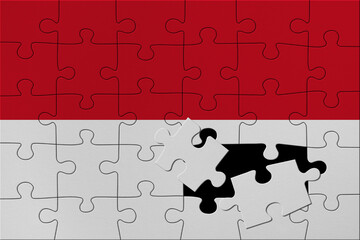 World countries. Broken puzzle- background in colors of national flag. Indonesia