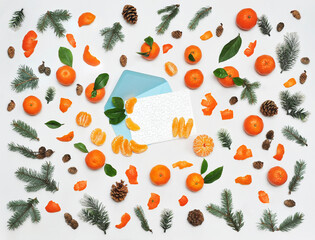Winter set with fresh mandarins full and slices ,pine tree branches ,cones , greeting design card...