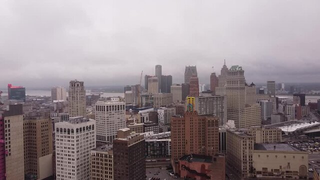 City skyline with majestic skyscrapers in Detroit, high altitude aerial shot on moody day