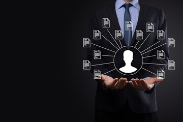 Document Management System DMS .Businessman hold user and document icon.Software for archiving,...
