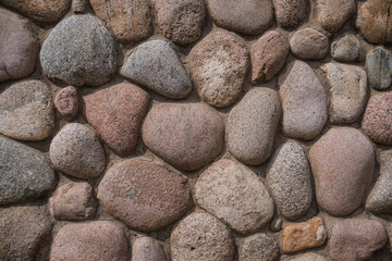 Stone wall texture. Old castle stone wall texture background. Stone wall as background or texture. Part of a stone wall for background or texture.