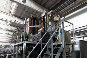 Photo of modern automatic automobile manufacturing workshop. Car production. Industrial scenery background