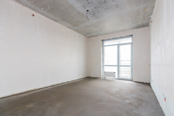 interior of the apartment without decoration in gray colors. rough finish