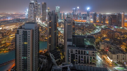 Aerial panoramic view of a big futuristic city night to day timelapse. Business bay and Downtown