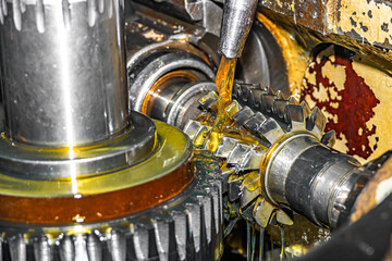 Making a gear and cutting a tooth with a worm cutter on a gear cutting machine.