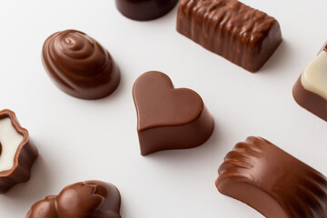 Chocolates with heart shape isolated on white background.