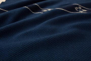 Close up of texture of hand woven plaid shawl, Thai cotton indigo dyed
