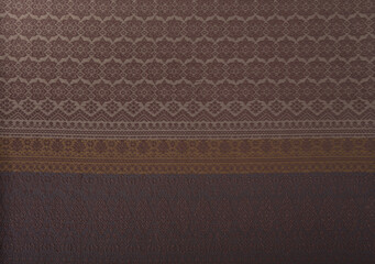 Close up of texture of Thai cotton knitted pattern fabric in earth tone color