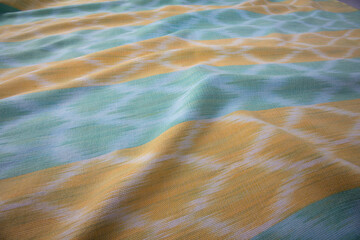Close up of texture of hand woven cotton cloth, Thai cotton natural color dyed