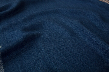 Close up of texture of hand woven shawl, Thai cotton indigo dyed
