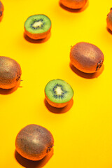 Fresh kiwi fruit on pink background, flat lay