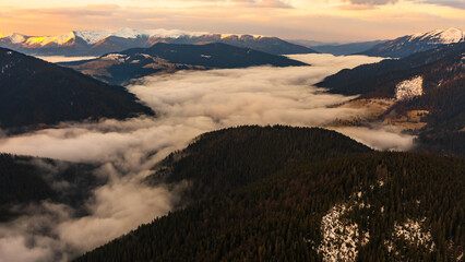 Cloudy skies over the mountains, rainy spring clouds over the forest and mountain tops.