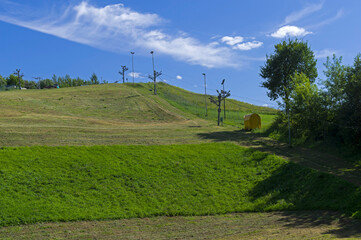Fototapeta na wymiar Small ski slope in summer.