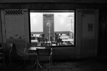 Venice, Italy, January 28, 2020 evocative black and white image of the interior of a coffee shop...