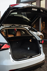 Luxury car boot with folded seats. Opened empty car trunk. Clean trunk of the SUV.