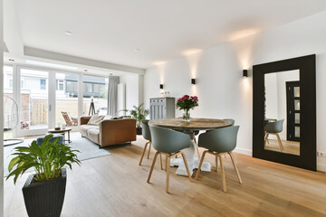 Lovely living room combined with a dining area with a round table