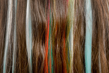 Fototapeta premium Beautiful teenage hairstyle. Rebellious style. Hair with multi-colored strands. Selection