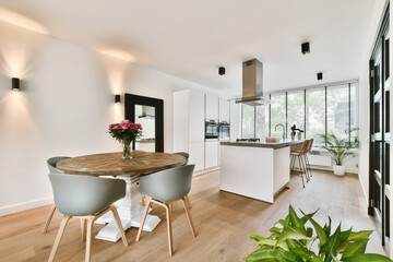 Lovely kitchen combined with a dining area with a round table