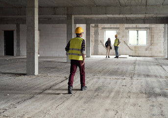 Group of people working on construction site